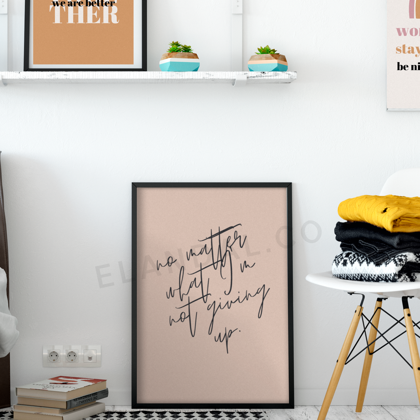 Image of El and Al Co's "No Matter What, I'm Not Giving Up" Inspirational Artwork Black Frame on the Floor of a Workspace with a White Wall.