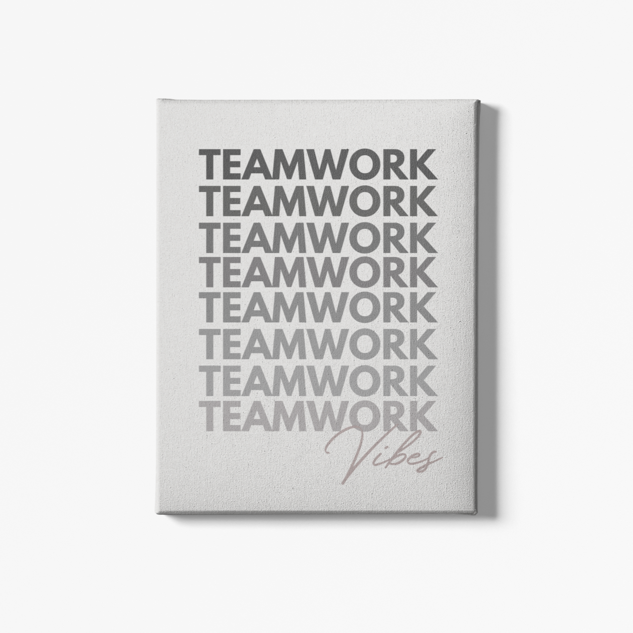 A rectangular canvas artwork with the text 'TEAMWORK VIBES' displayed in a minimalist typographic design, mounted on a premium wood frame.