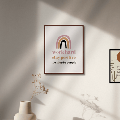 Framed motivational poster with rainbow design on a wall with soft lighting