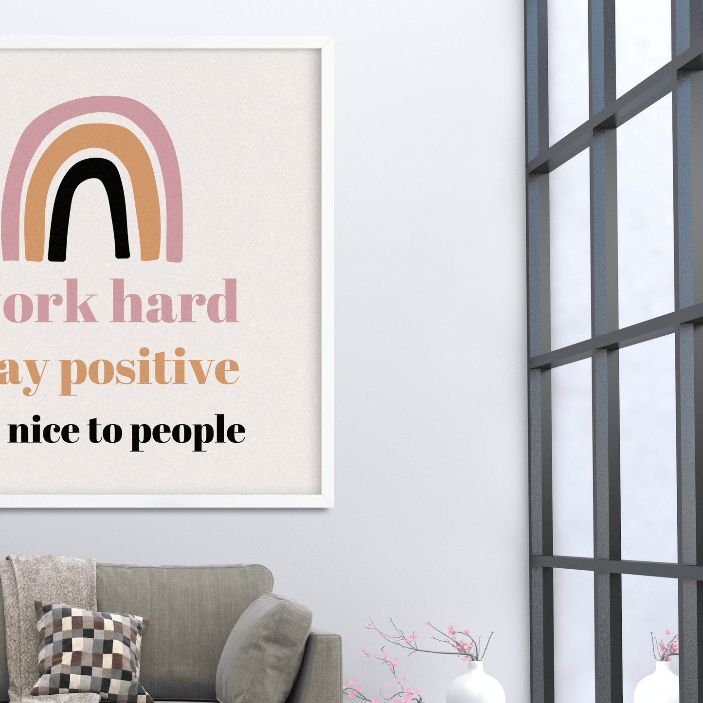Motivational poster with rainbow design and text on a wall above a sofa.